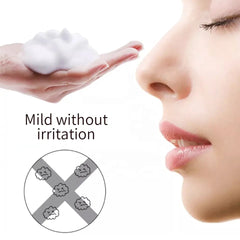 Close-up of soft white micro-foam dispensed from a lash cleanser pump